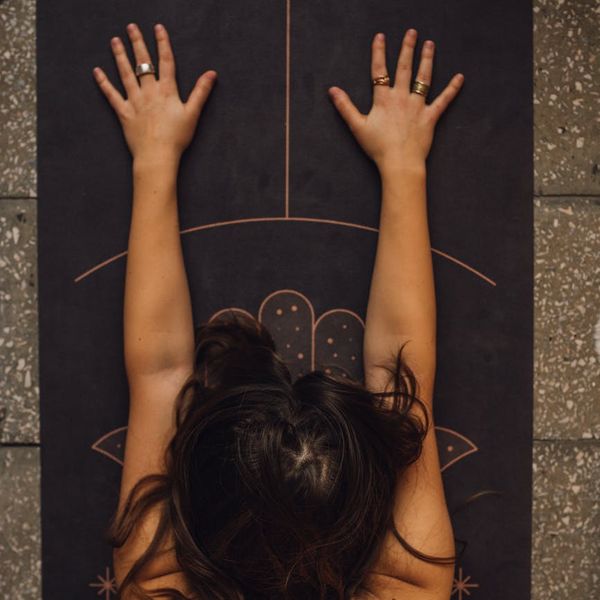 Woman meditating in a serene yoga pose, finding inner peace.